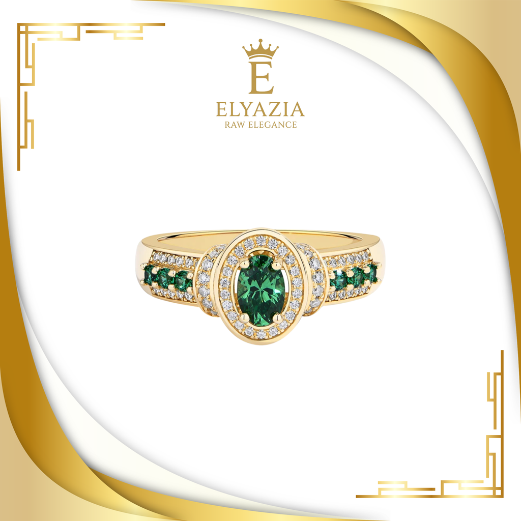 Gold ring with green gemstones on a white background with Elyazia logo