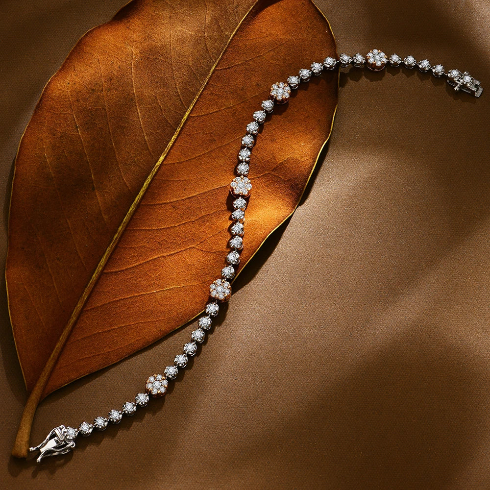 Silver bracelet with diamonds on a brown leaf