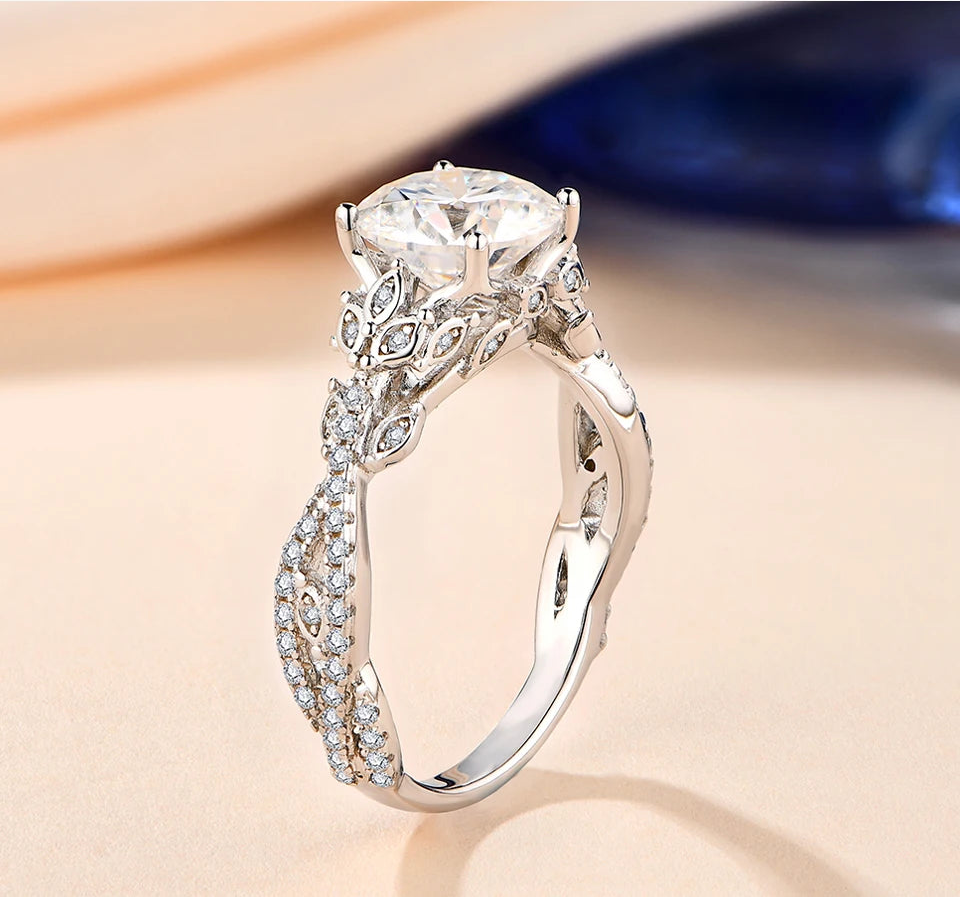 Elegant silver ring with a large diamond and intricate design on a soft background